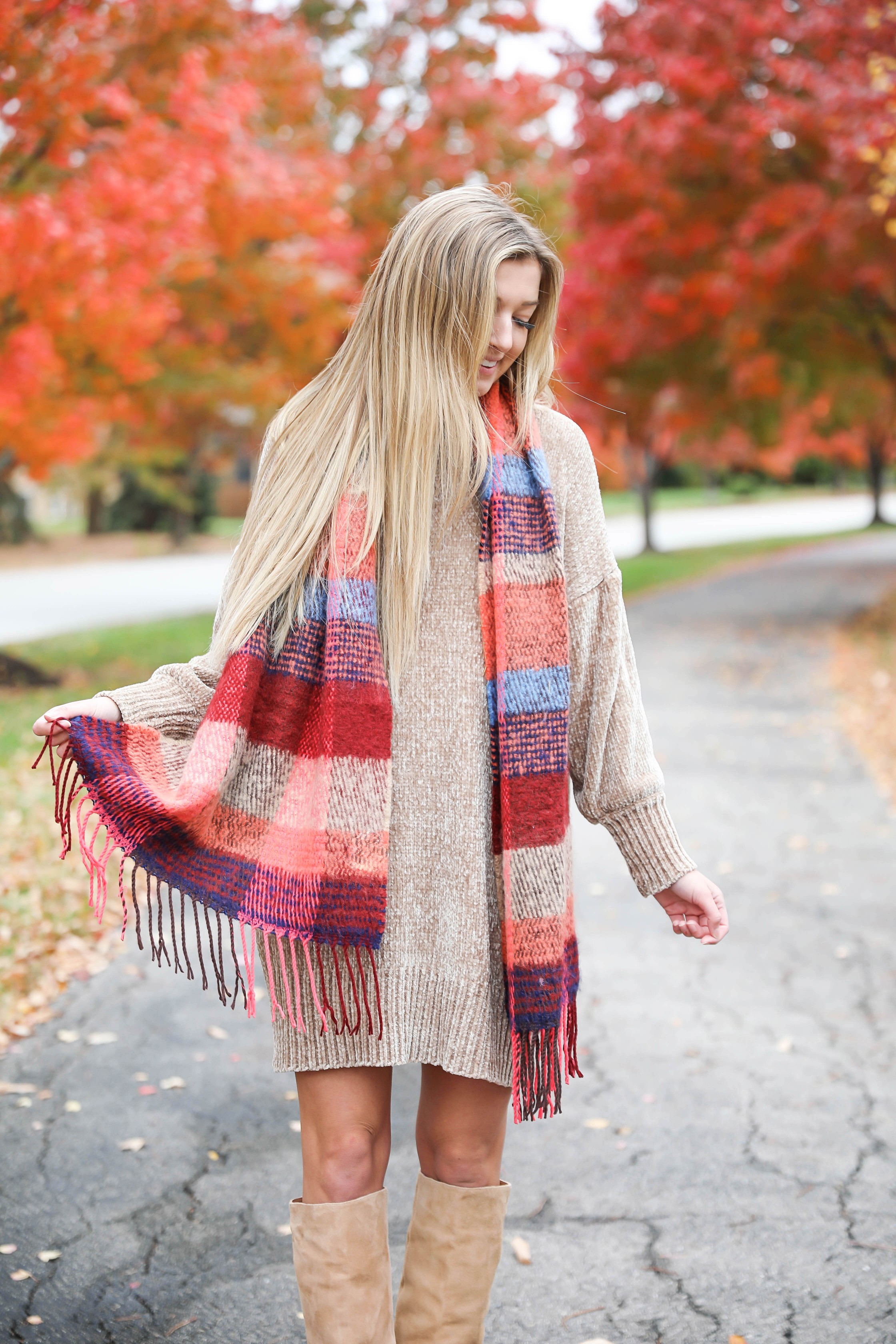 Chenille sweater dress form Red Dress Boutique! I love sweater dresses and chenille is my favorite trend for fall 2018! I paired it with this cute plaid scarf and my favorite tan boots! Nothing like a cute fall outfit in front of beautiful red autumn leaves on the trees! Details on fashion blog daily dose of charm by lauren lindmark