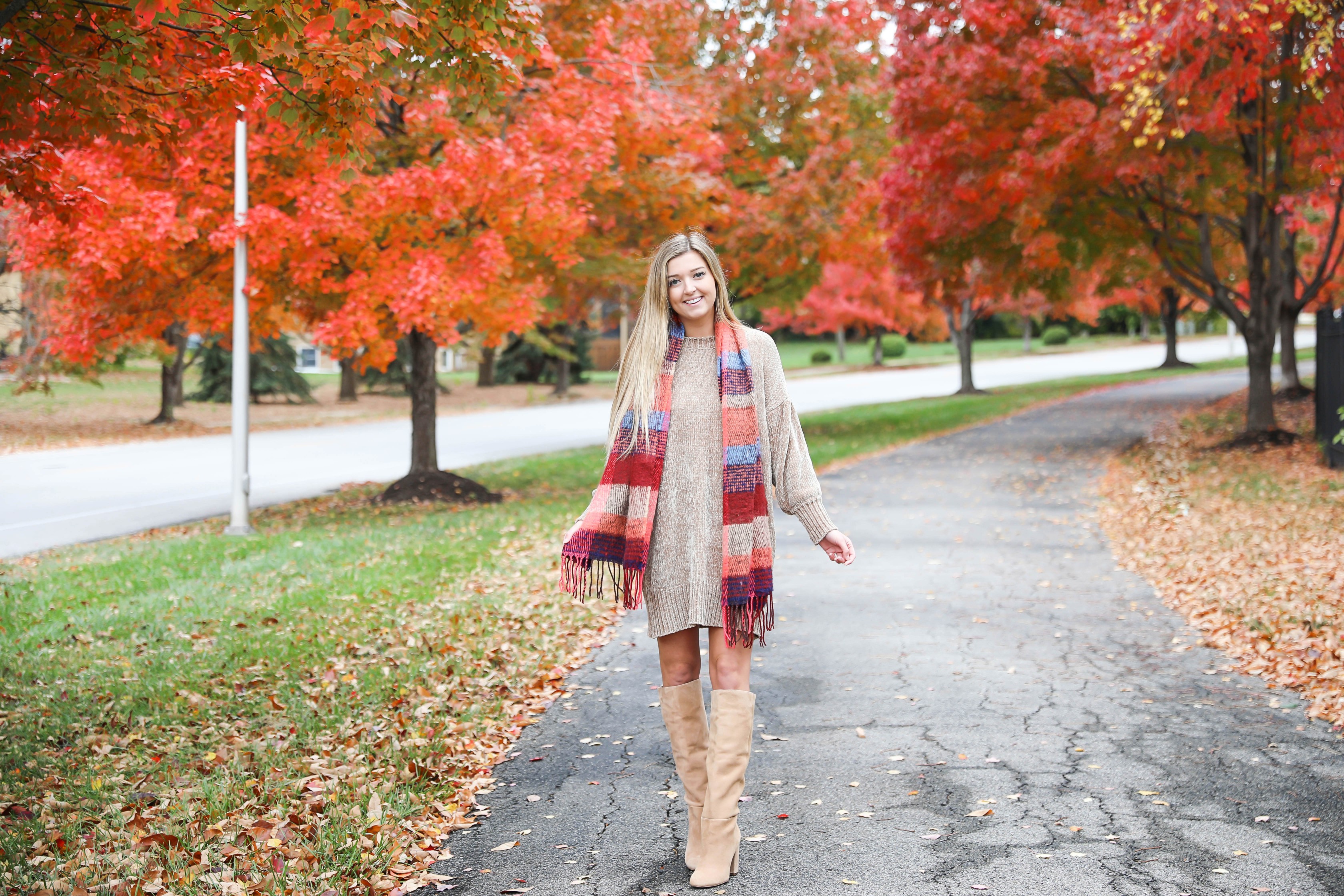 Chenille sweater dress form Red Dress Boutique! I love sweater dresses and chenille is my favorite trend for fall 2018! I paired it with this cute plaid scarf and my favorite tan boots! Nothing like a cute fall outfit in front of beautiful red autumn leaves on the trees! Details on fashion blog daily dose of charm by lauren lindmark