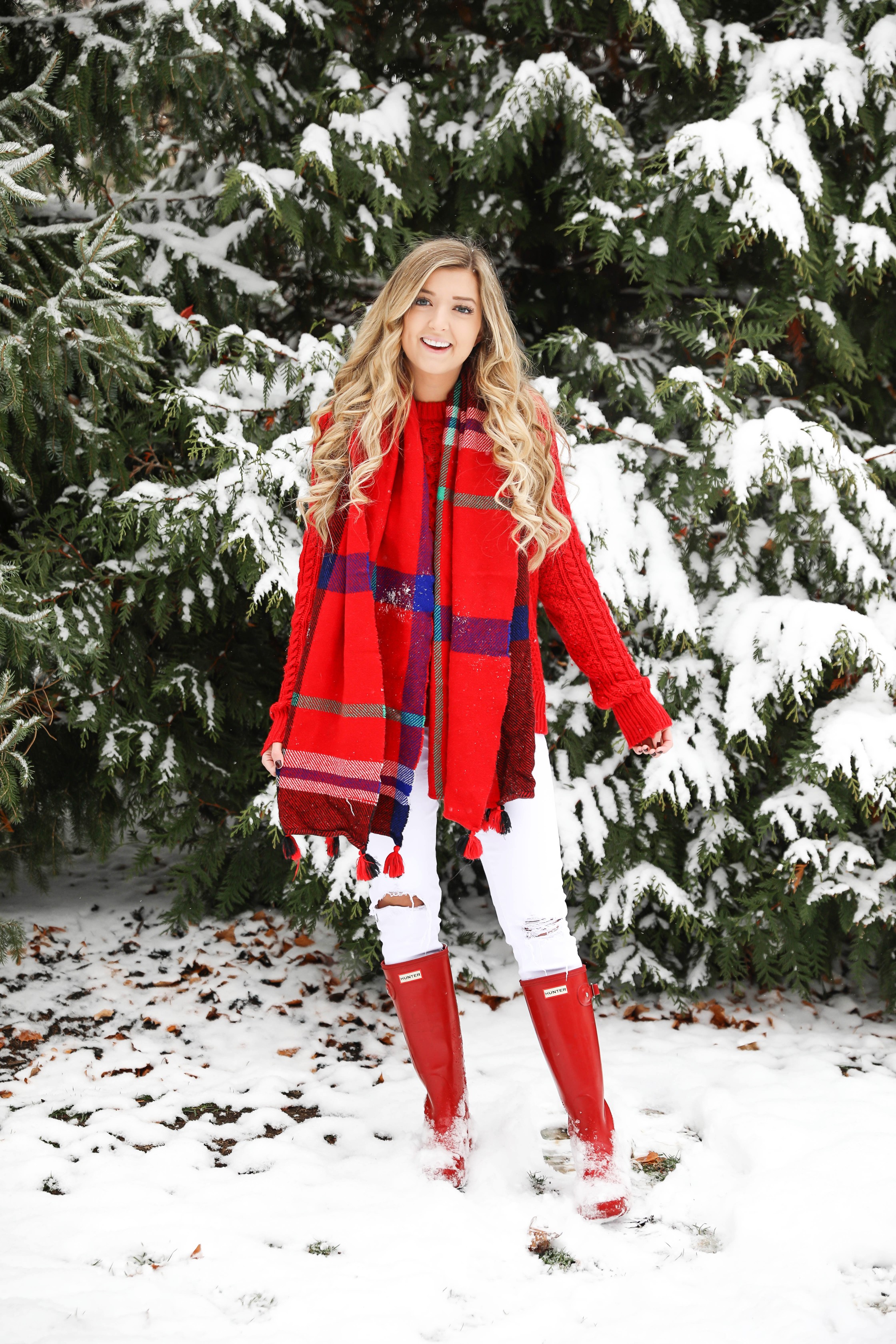 Christmas card photos in the snow! I took my holiday card photos with my cute little white pomeranian. I love when people do their holiday pictures with their dog! This is such a cute winter outfit idea for the holidays! Details on fashion blog daily dose of charm by lauren lindmark