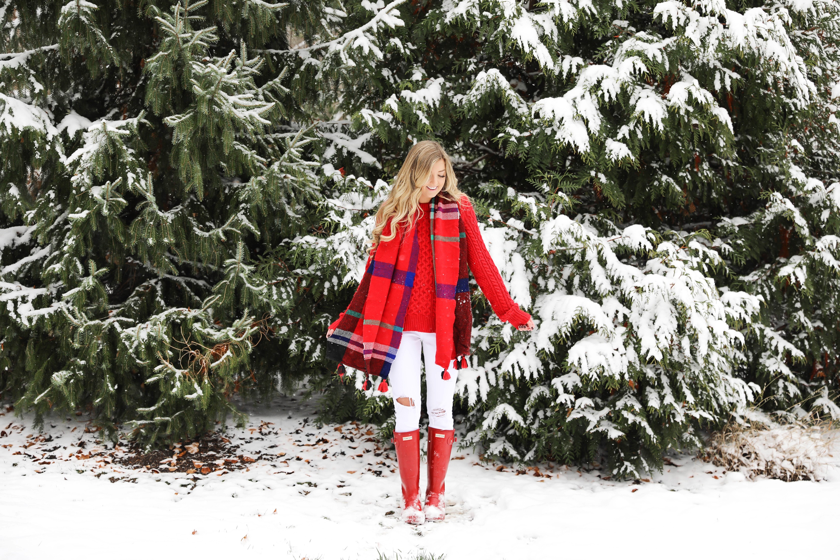 Christmas card photos in the snow! I took my holiday card photos with my cute little white pomeranian. I love when people do their holiday pictures with their dog! This is such a cute winter outfit idea for the holidays! Details on fashion blog daily dose of charm by lauren lindmark