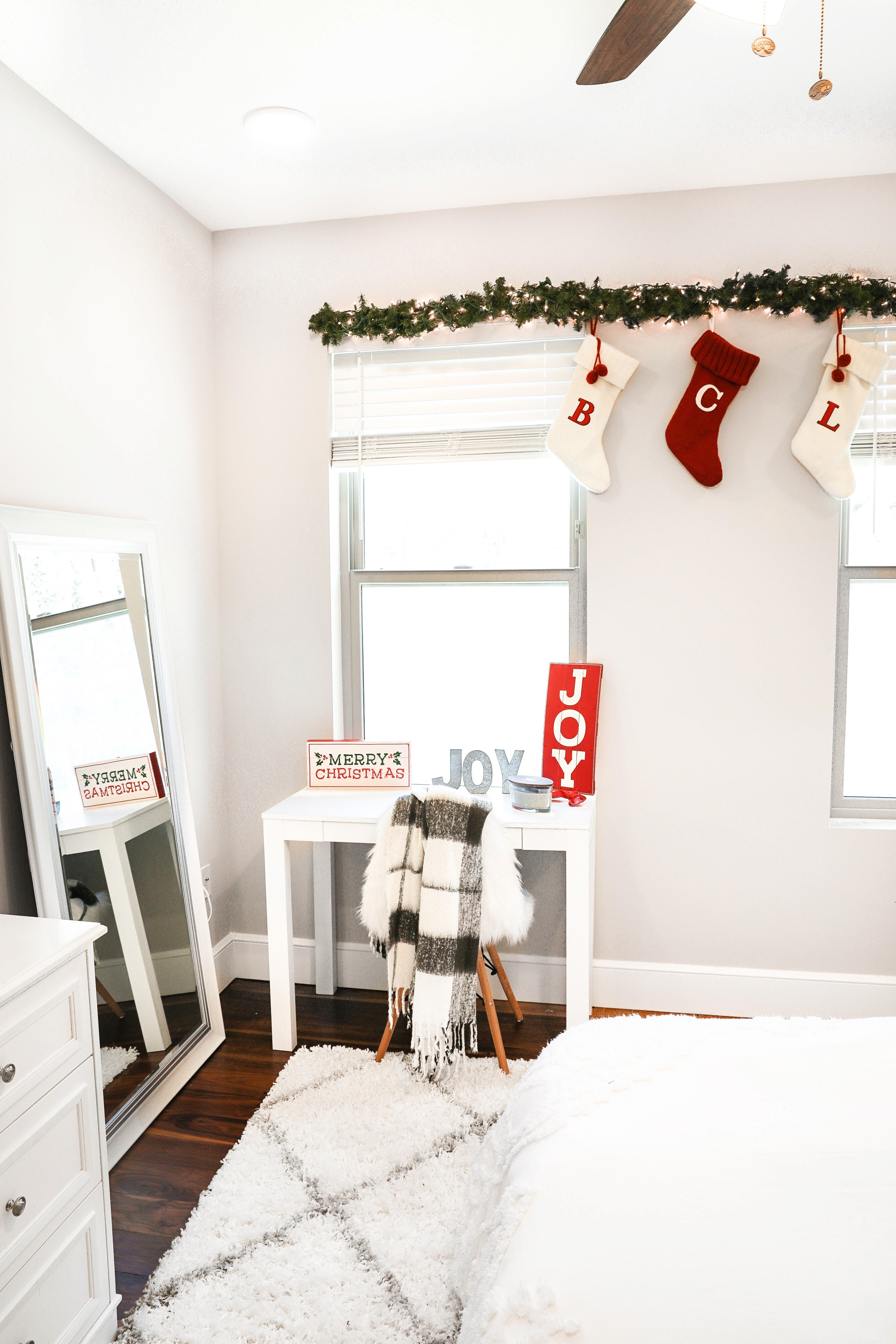 Holiday room decor! Decorate my apartment for Christmas with me! I blogged my adorable white, red, and green christmas tree! I also hung up some cute, inexpensive garland! Cutest white room decorations! Get all the details on fashion blog daily dose of charm by lauren lindmark