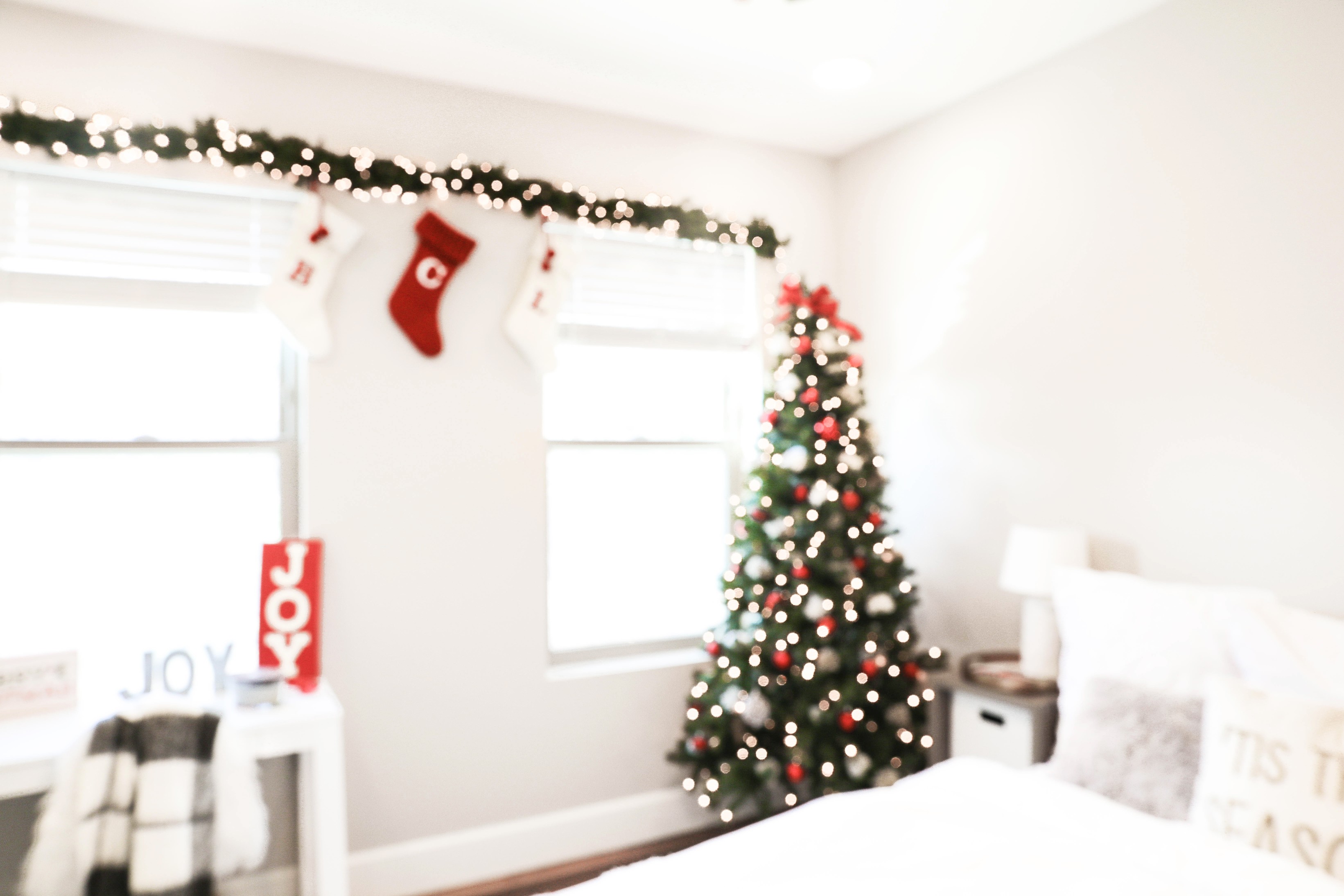 Holiday room decor! Decorate my apartment for Christmas with me! I blogged my adorable white, red, and green christmas tree! I also hung up some cute, inexpensive garland! Cutest white room decorations! Get all the details on fashion blog daily dose of charm by lauren lindmark