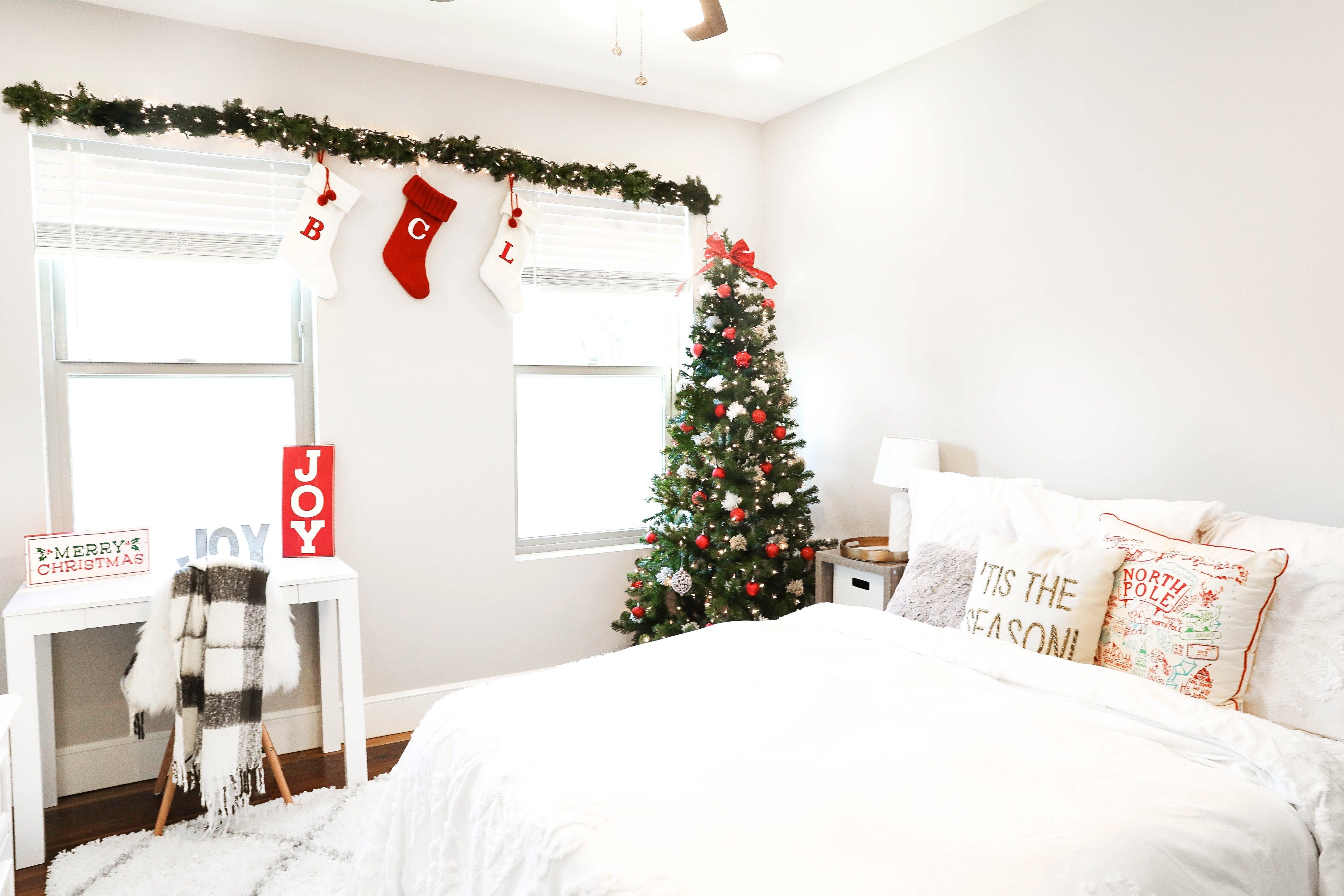 Holiday room decor! Decorate my apartment for Christmas with me! I blogged my adorable white, red, and green christmas tree! I also hung up some cute, inexpensive garland! Cutest white room decorations! Get all the details on fashion blog daily dose of charm by lauren lindmark