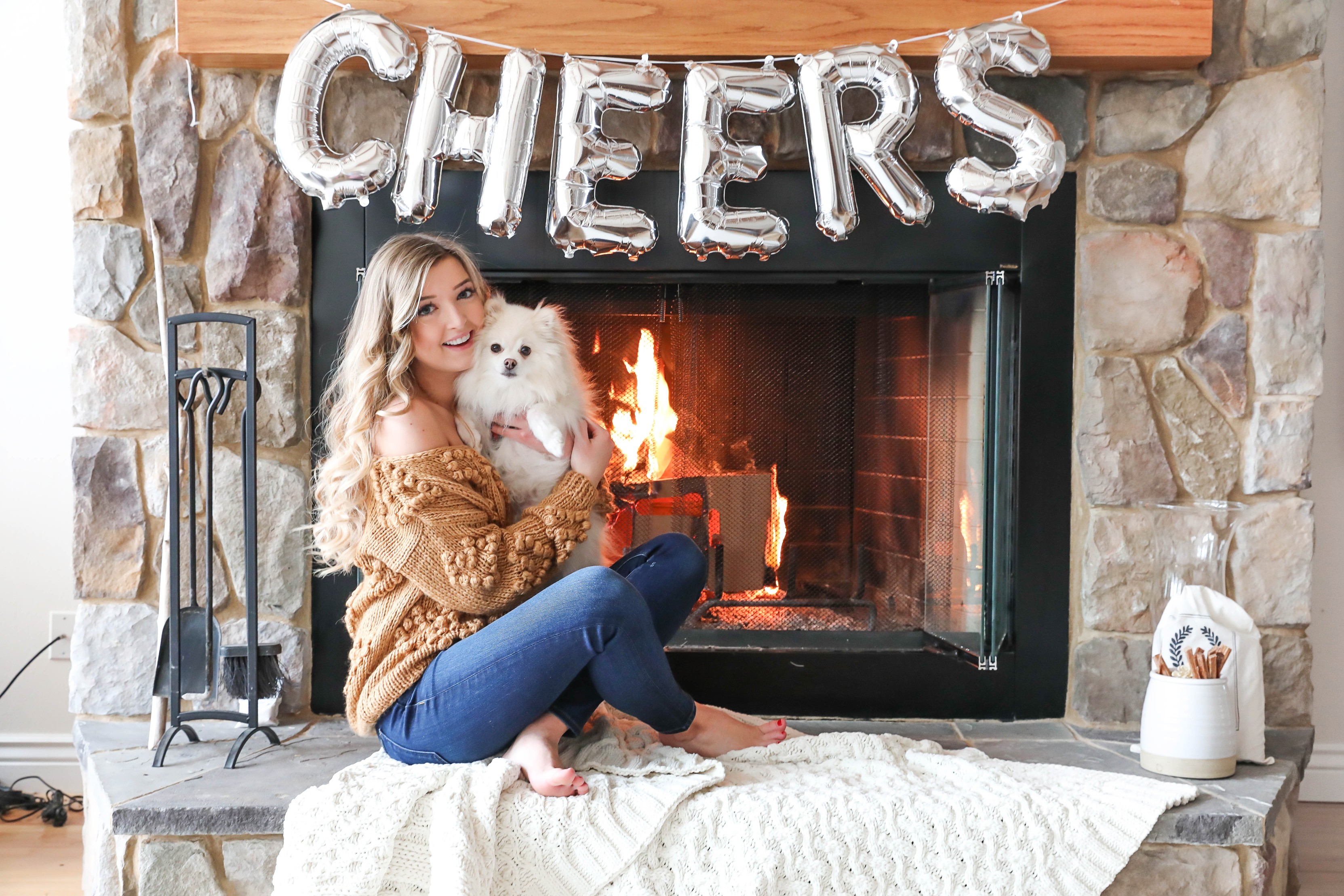 Happy New Year! The cutest photoshoot with "cheers" balloons! New Year's Eve photoshoot next to a cozy fireplace! I also list out all my resolutions for the year! My cute Pomeranian pup is featured in some of the photos! Details on fashion blog daily dose of charm by lauren lindmark