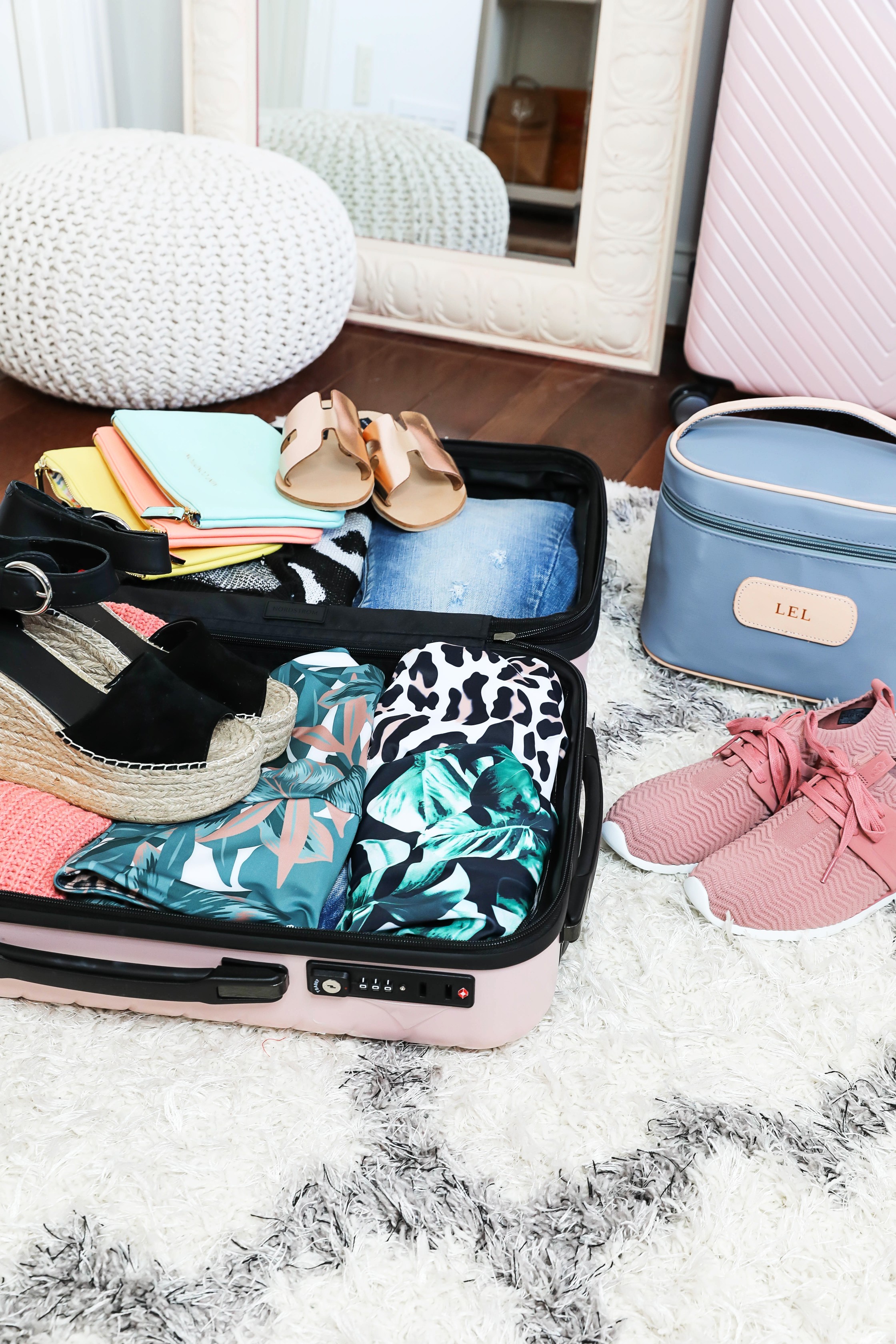 Packing tips for a trip from the queen of overpacking! I use the cutest Nordstrom suitcase and Jon Hart luggage for my trips! Spring break packing with the latest spring trends! How cute are these ugg sneakers, Marc Fisher wedges? Details on fashion blog daily dose of charm by lauren lindmark