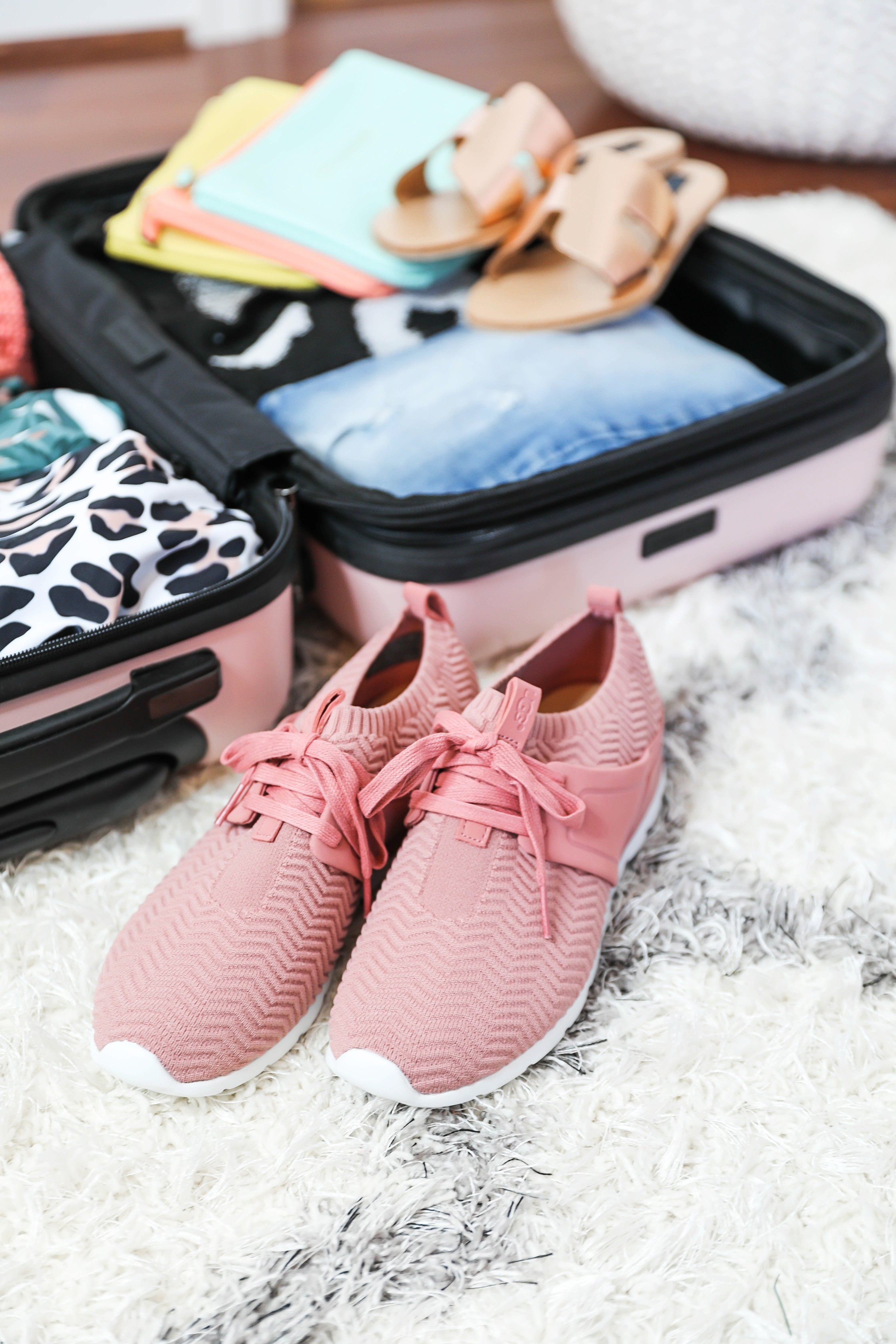 Packing tips for a trip from the queen of overpacking! I use the cutest Nordstrom suitcase and Jon Hart luggage for my trips! Spring break packing with the latest spring trends! How cute are these ugg sneakers, Marc Fisher wedges? Details on fashion blog daily dose of charm by lauren lindmark