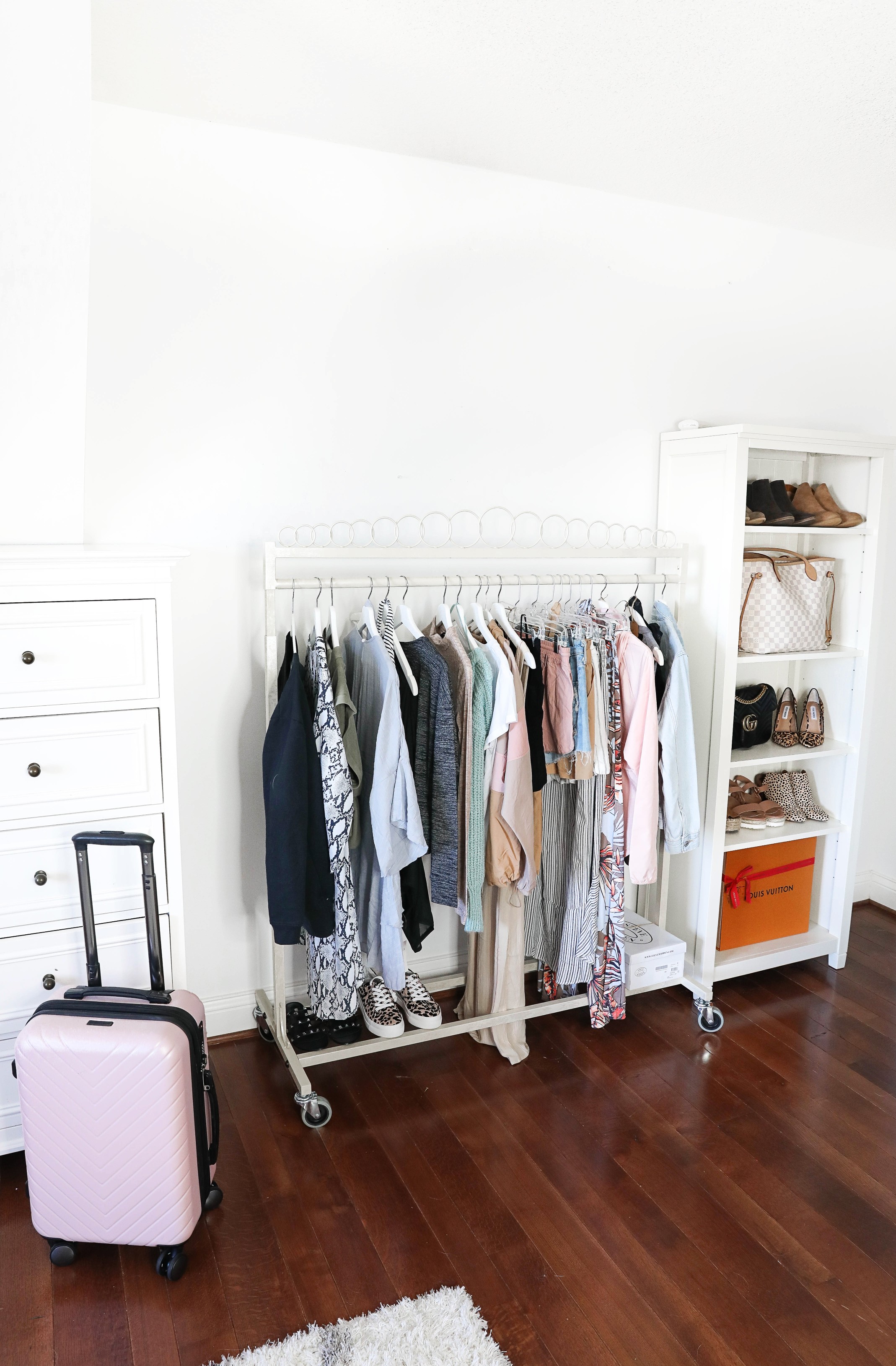 How I plan my outfits for trips and blog photos! Total closet and wardrobe goals! I love my new garment rack right next to my shoe rack and fashion shelves! All the travel packing planning tips you need! Details on fashion blog daily dose of charm by lauren lindmark