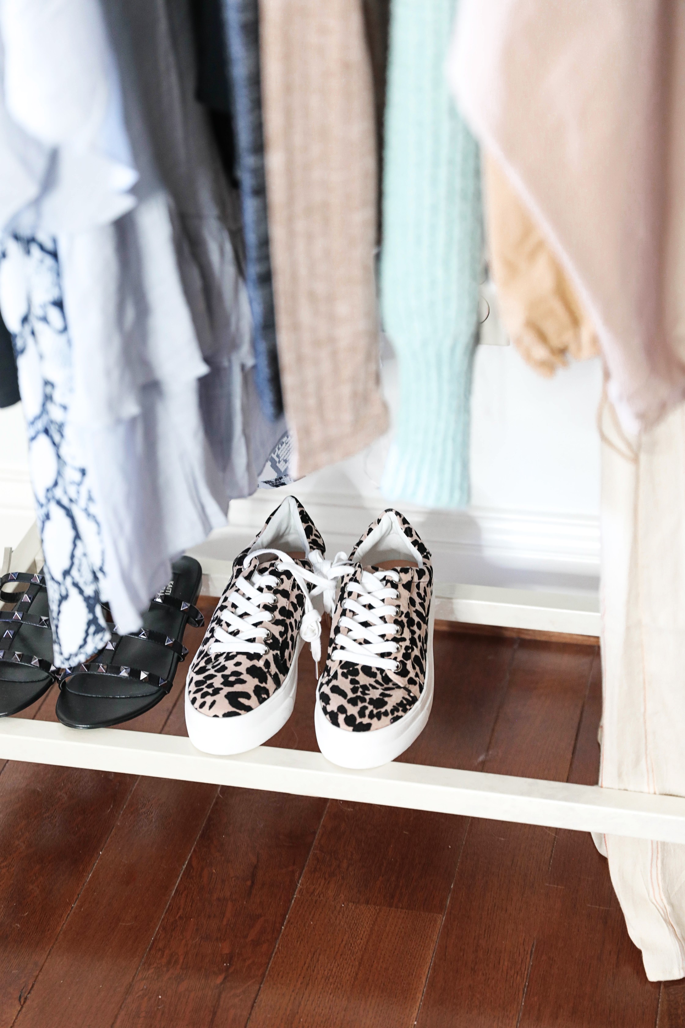 How I plan my outfits for trips and blog photos! Total closet and wardrobe goals! I love my new garment rack right next to my shoe rack and fashion shelves! All the travel packing planning tips you need! Details on fashion blog daily dose of charm by lauren lindmark