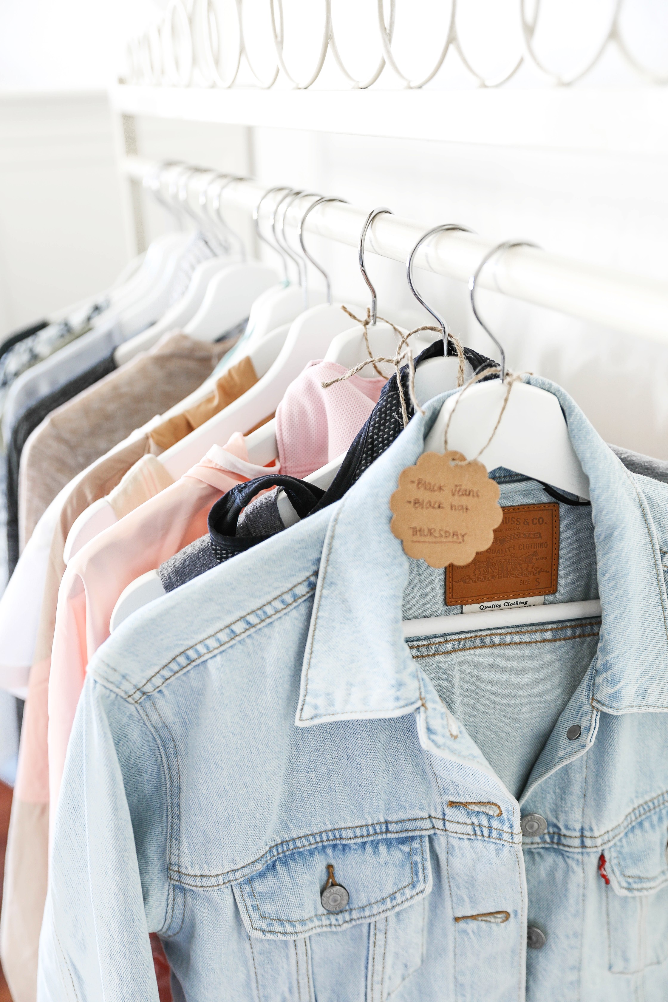 How I plan my outfits for trips and blog photos! Total closet and wardrobe goals! I love my new garment rack right next to my shoe rack and fashion shelves! All the travel packing planning tips you need! Details on fashion blog daily dose of charm by lauren lindmark