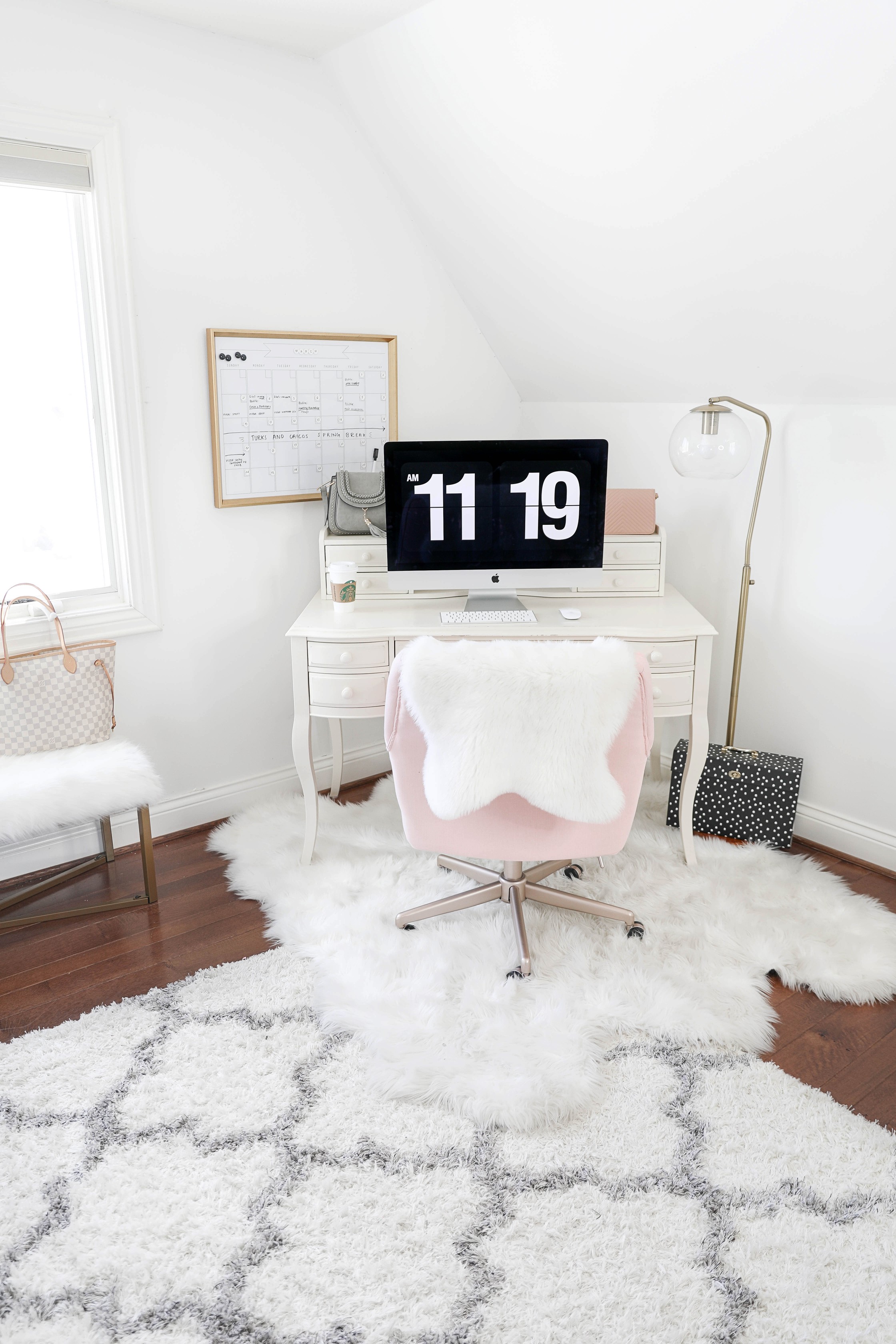 Office tour! Ultimate desk goals for the girl boss! I love this super comfy pink desk chair! I had been looking for a new chair and found the perfect one! The space looks so cute with my faux sheep fuzzy rug, and all the white, black, gold and pink. This is also the cutest gold dry erase calendar! Details on fashion and lifestyle blog daily dose of charm by lauren lindmark