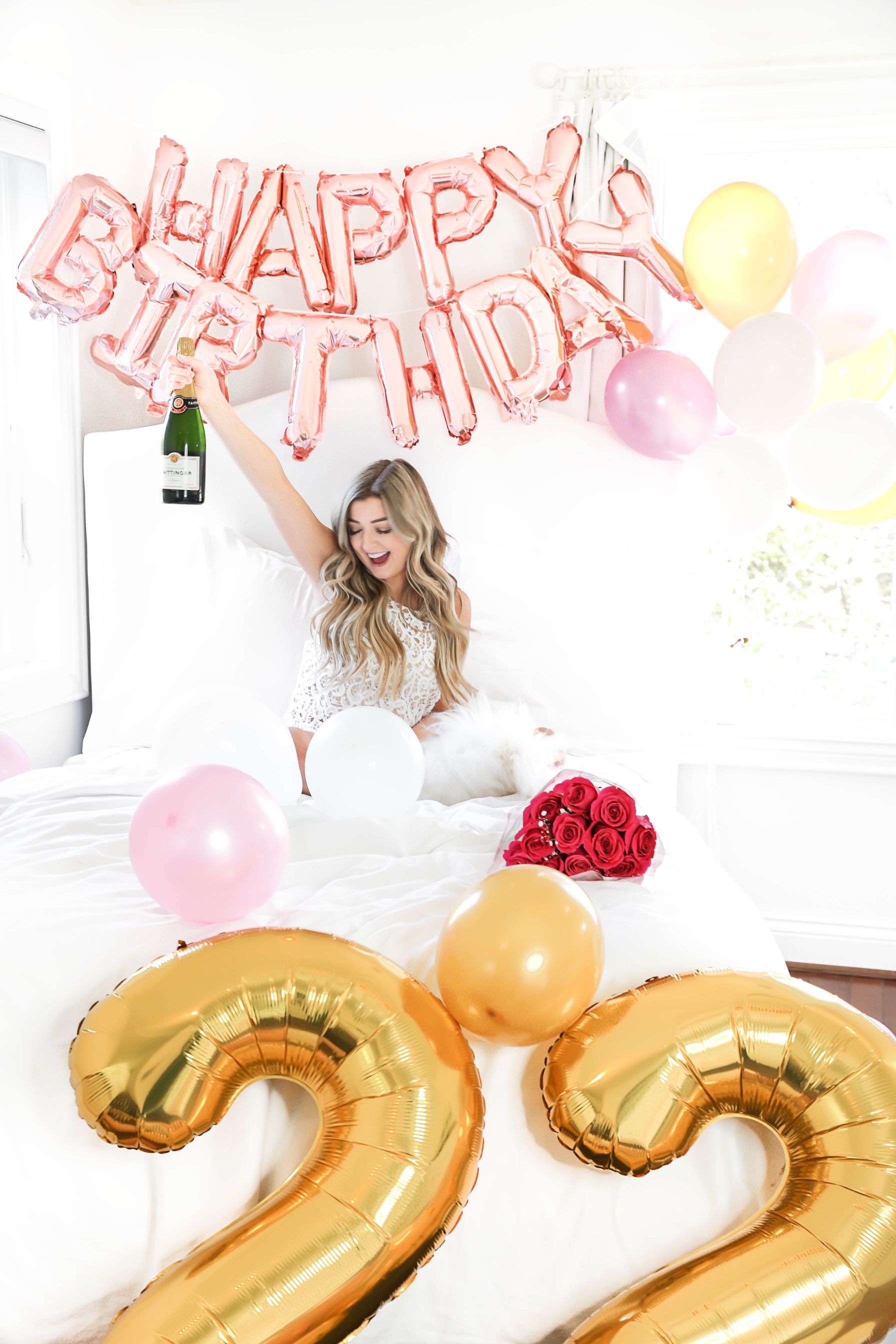 Happy birthday balloons photoshoot in bed with happy birthday blow ups and champagne! Details on fashion blog daily dose of charm by lauren lindmark