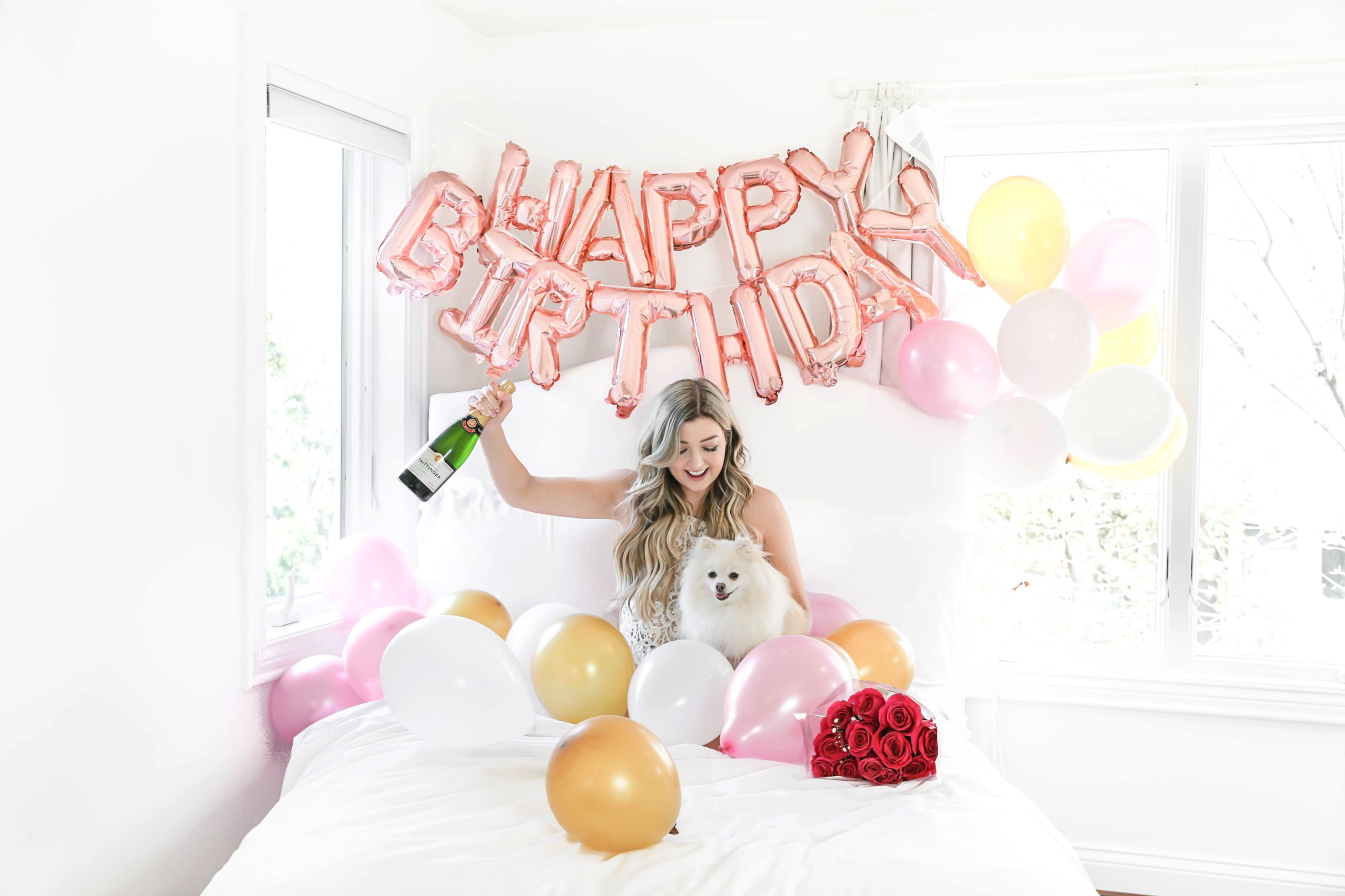 Happy birthday balloons photoshoot in bed with happy birthday blow ups and champagne! Details on fashion blog daily dose of charm by lauren lindmark