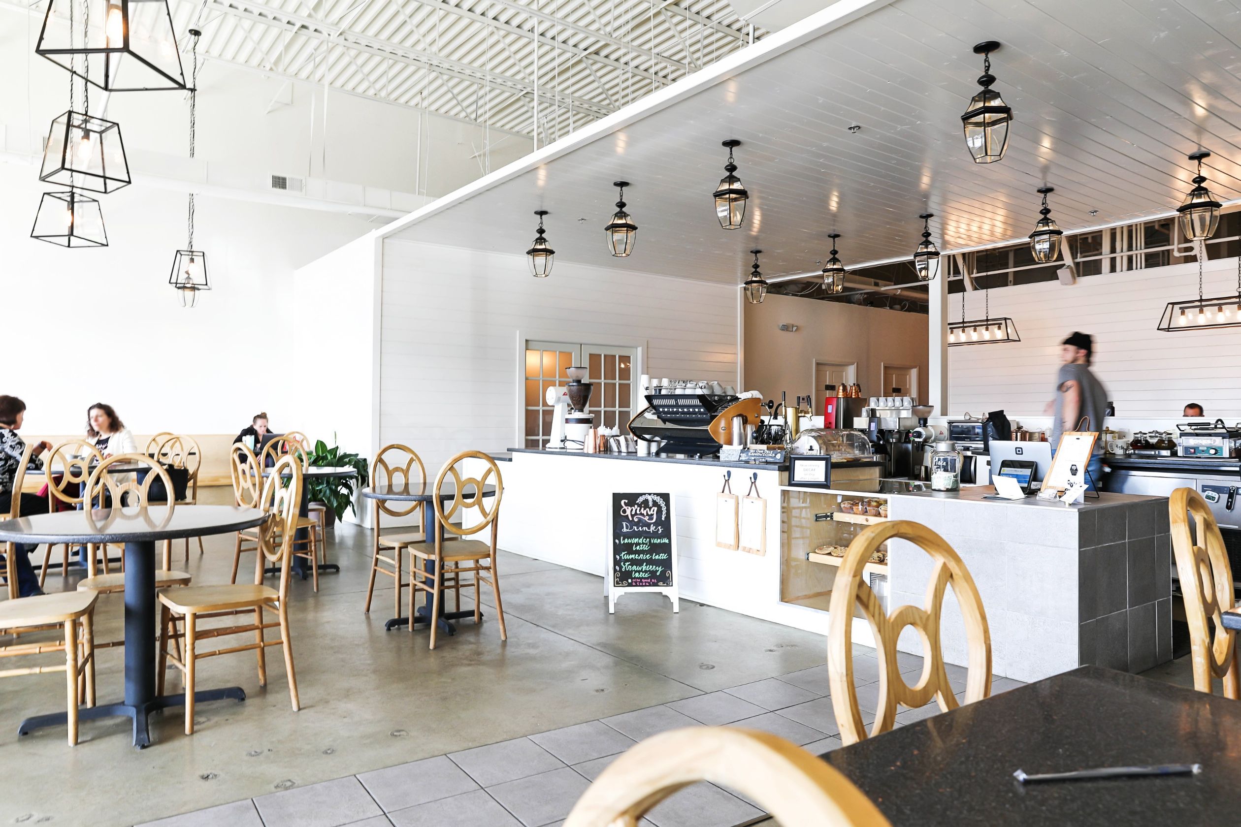 Best Kansas City Coffee shops! Cute restaurant photoshoot wearing an off the shoulder sweater! Details on fashion blog daily dose of charm by lauren lindmark