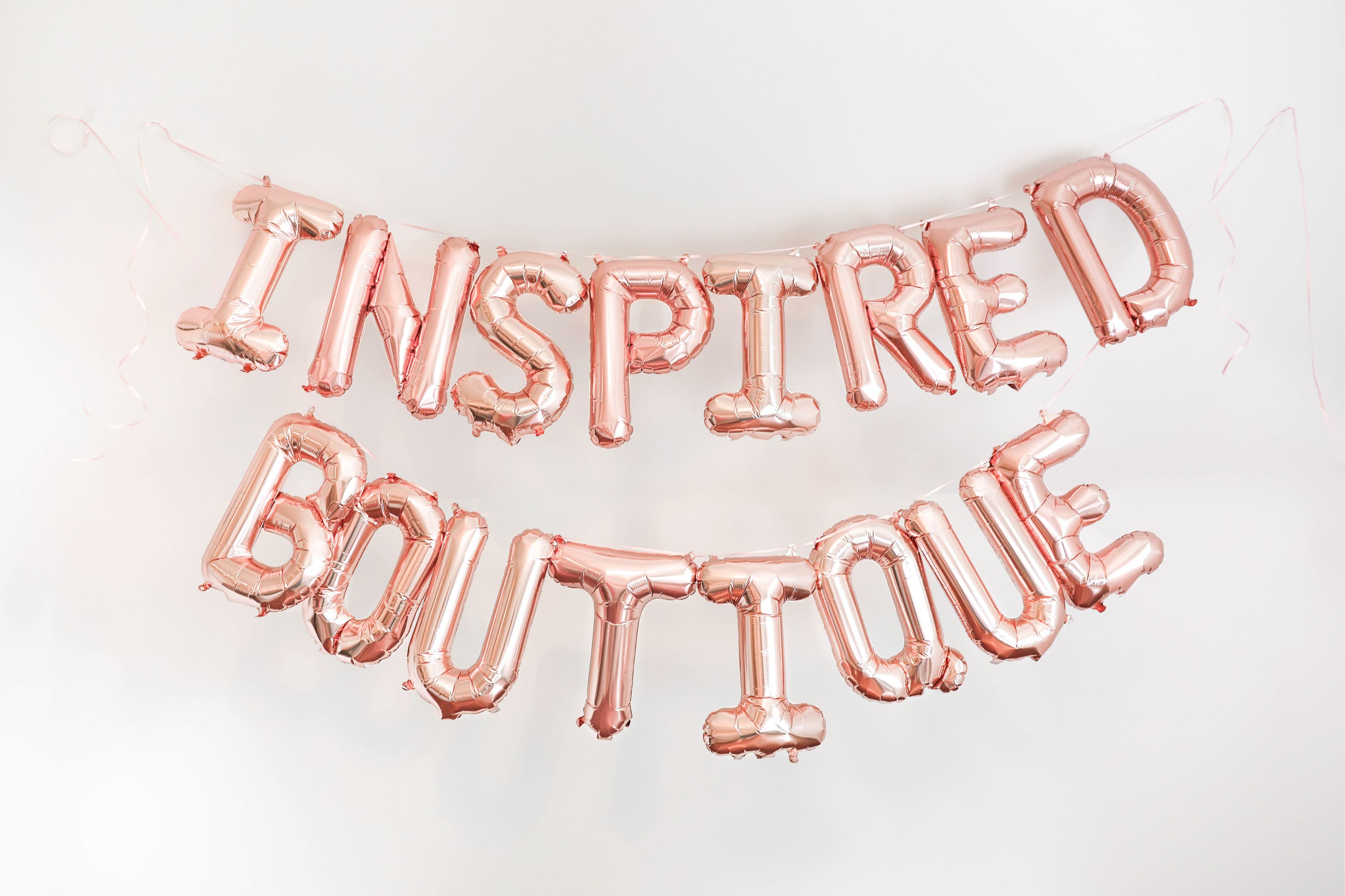 Inspired boutique daily dose of charm lauren lindmark name reveal balloons photoshoot new store ecommerce